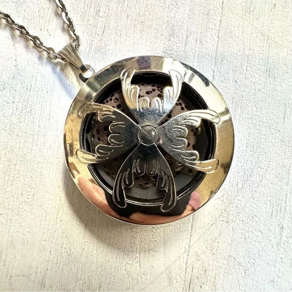 Silver tone long lava stone infuser pendant necklace